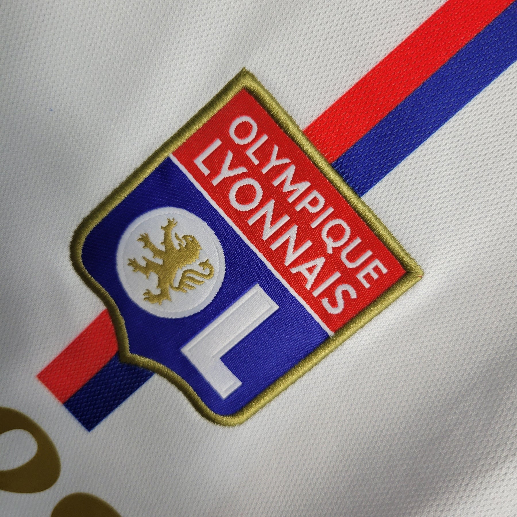 Camisa Lyon Home 2023/24 - Adidas Torcedor Masculina - Branca/Dourada