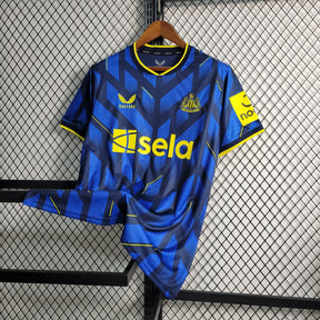 Camisa Newcastle Away 2023/24 - Castore Torcedor Masculina - Azul/Amarela